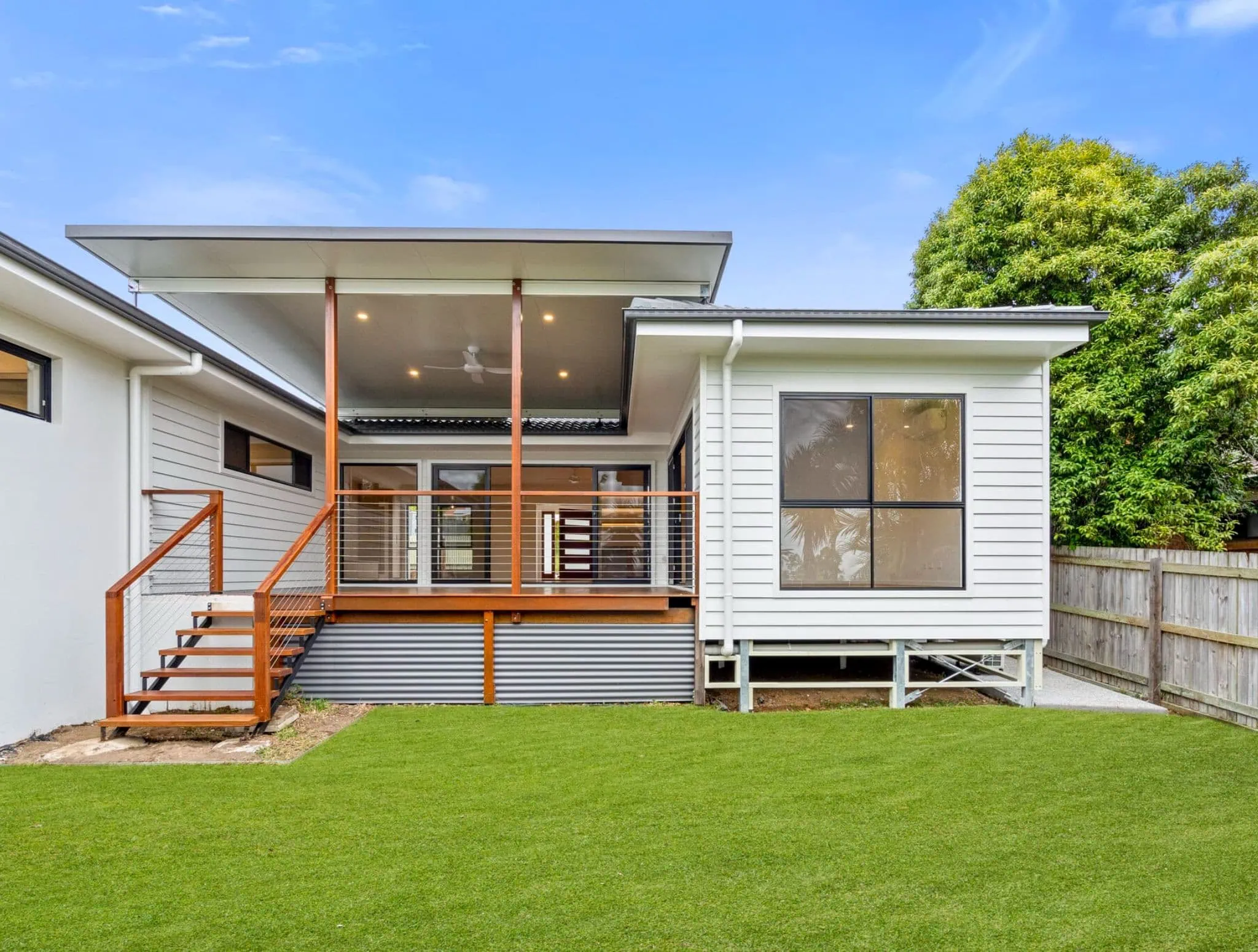 Modern house with green lawn.
