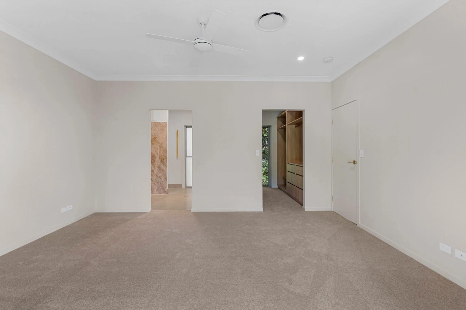 Bedroom with ensuite and walk-in robe access at the Ney Road renovation, Capalaba
