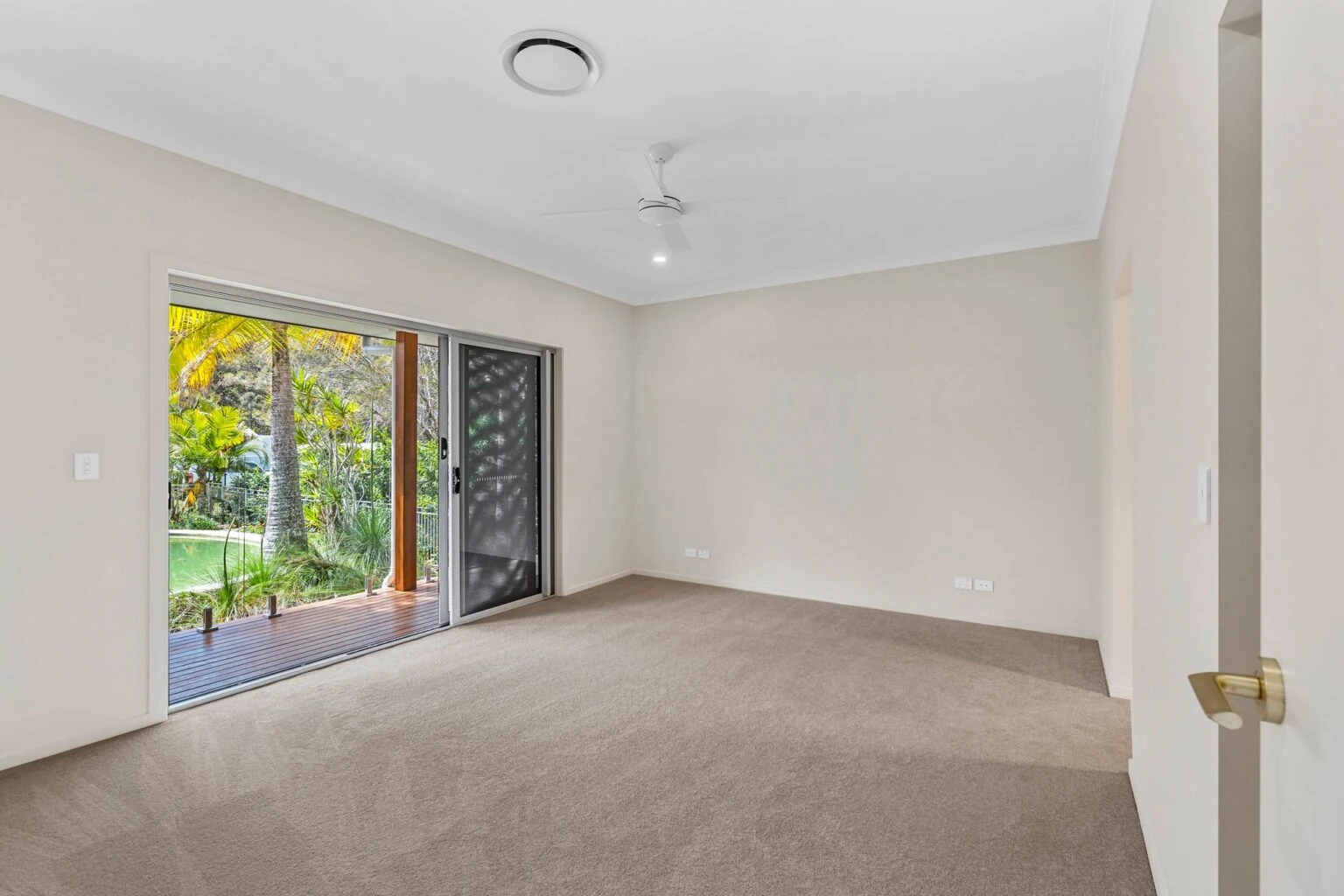 Bedroom opening onto the pool deck at the Ney Road renovation, Capalaba