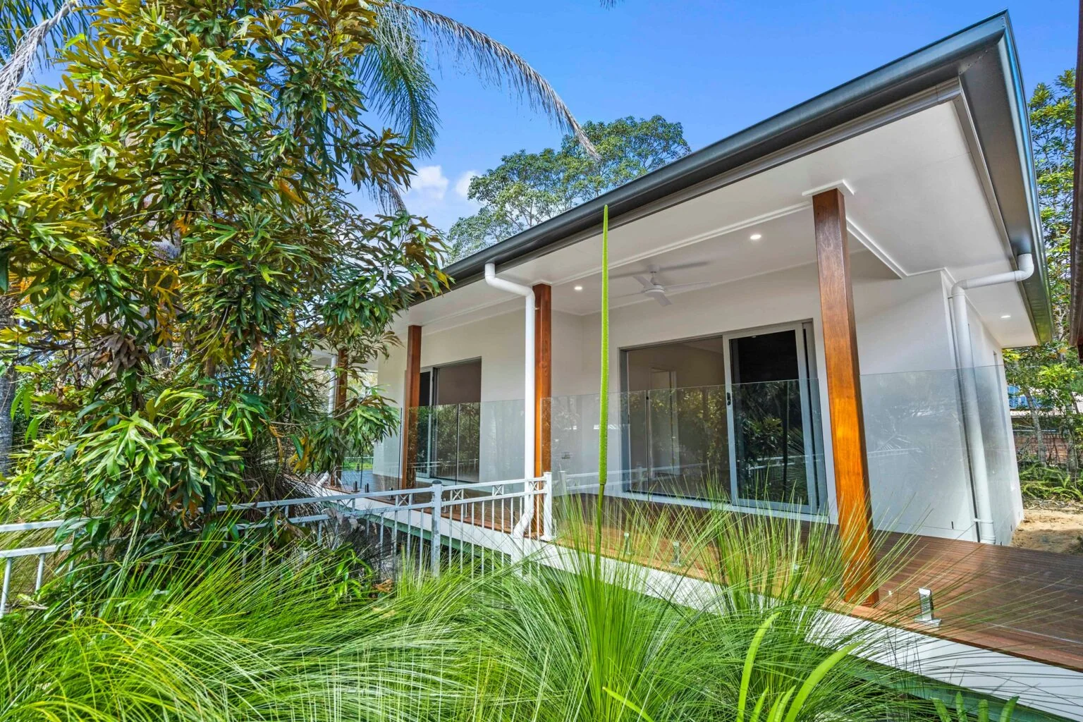 Exterior view of the completed home surrounded by native garden at the Ney Road renovation, Capalaba