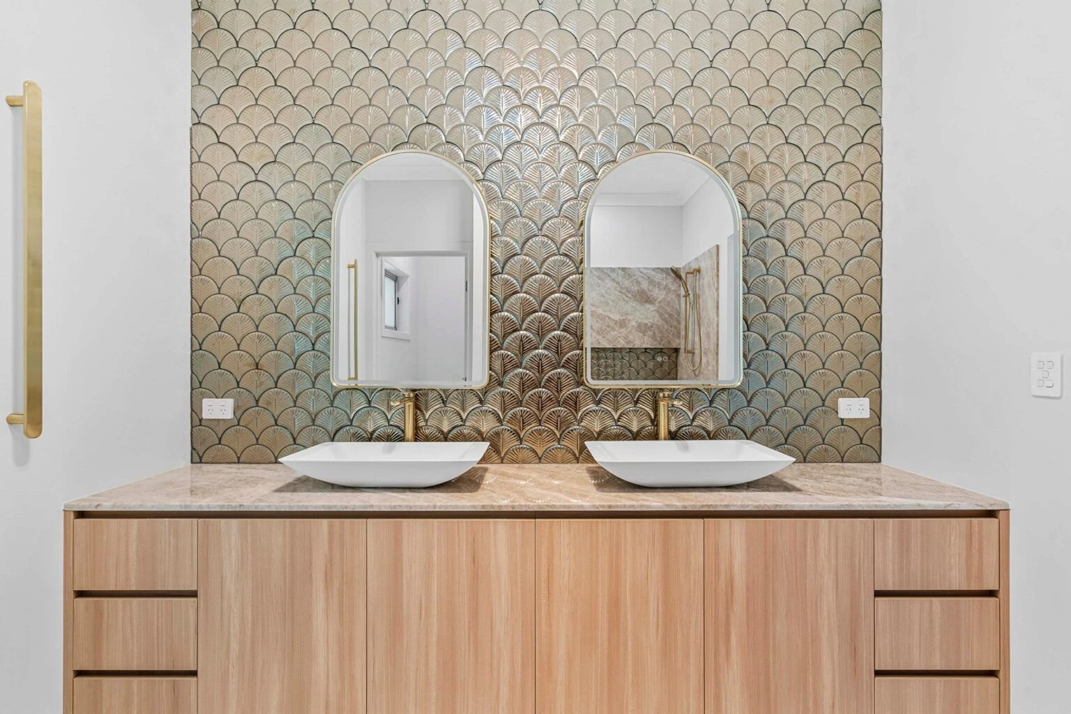 Double vanity with vessel basins and feature-tiled wall at the Ney Road renovation, Capalaba