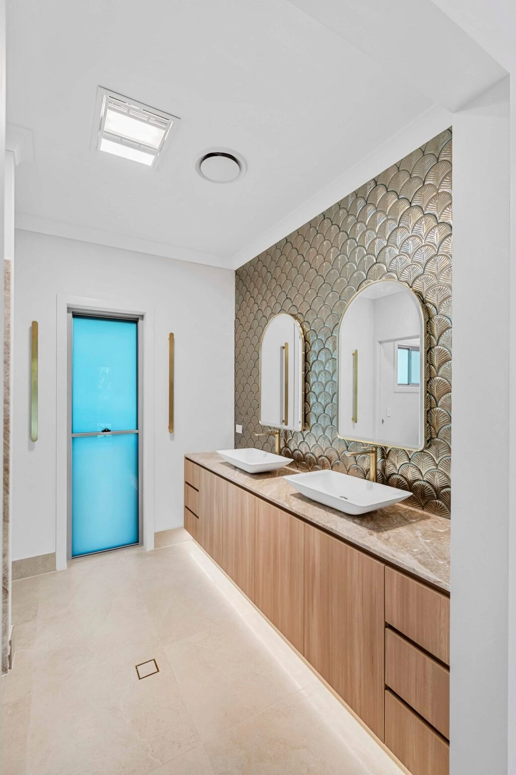 Ensuite bathroom with double vanity and feature tile wall at the Ney Road renovation, Capalaba